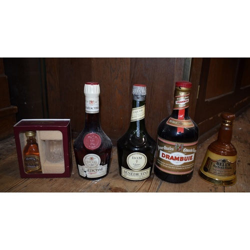 95 - A mixed group of spirits, to include: a 70cl Cointreau; a 70cl Drambuie; two half bottles of DOM Ben... 