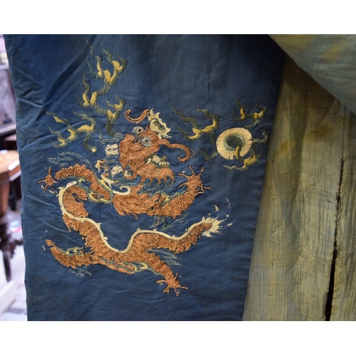 658 - A Chinese silk embroidered nine-dragon robe, 19th century, decorated with five-clawed dragons.... 