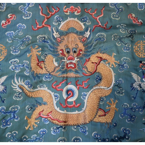 657 - A good Chinese silk embroidered nine-dragon robe, 19th century, decorated with five-clawed dragons a...