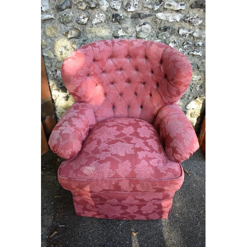 1069 - An old button back armchair.This lot can only be collected on Saturday 1st August (10-2pm)... 