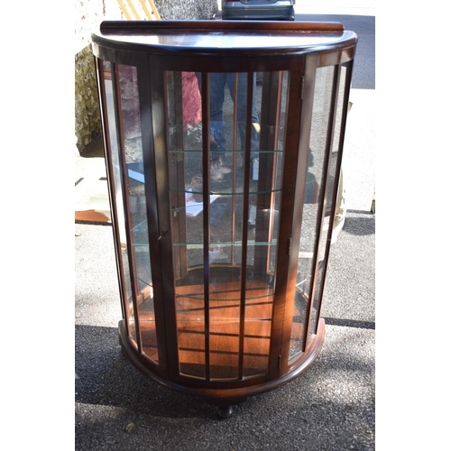 1073 - A 1920s mahogany demi lune display cabinet, 75cm wide.This lot can only be collected on Saturday 1st... 