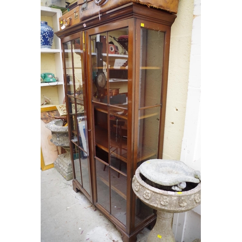 1279 - A mahogany glazed display cabinet, having pair of doors enclosing four shelves, on bracket feet, 113... 