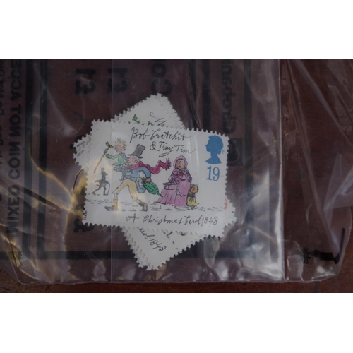 1304 - Stamps: a quantity of unused Royal Mail stamps.