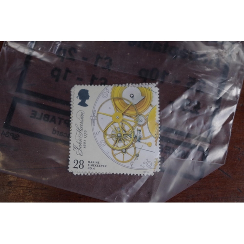 1304 - Stamps: a quantity of unused Royal Mail stamps.