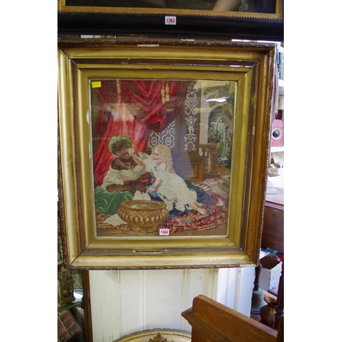 1364 - A Victorian woolwork picture of figures in a Moorish interior, 49 x 43cm.