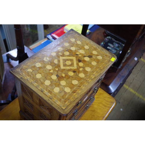 1459 - A good and unusual oak miniature chest, stamped 'B Shepherd', having two short and three long drawer... 
