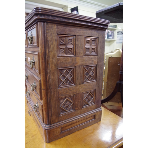 1459 - A good and unusual oak miniature chest, stamped 'B Shepherd', having two short and three long drawer... 