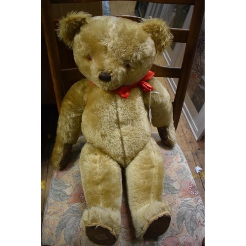 A large vintage Chad Valley golden mohair teddy bear with straw filled head and leather pads appro