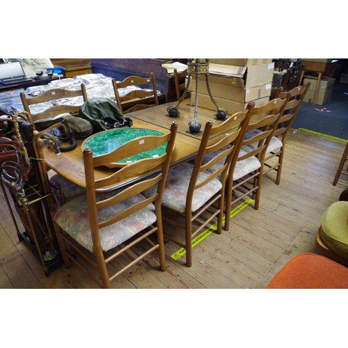 1766 - An Ercol 'Golden Dawn' dining table and chairs, comprising a drawleaf table, 203cm extended, and eig... 