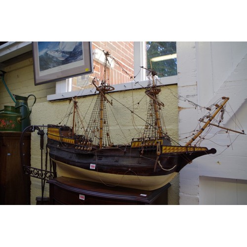 1089 - An old painted wood model galleon, the hull 93cm long.This lot can only be collected on Saturday 1st... 