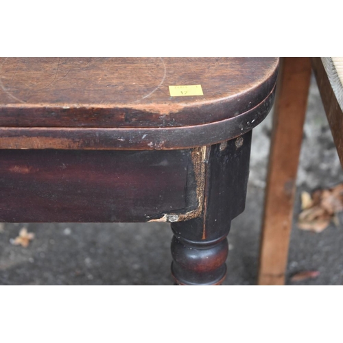 1019 - A Victorian mahogany tea table, 76cm wide; together with a rectangular pine table having one long dr... 