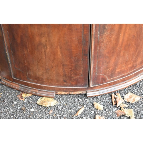 1050 - A George III inlaid mahogany barrel fronted corner cupboard, with shelves and drawers to interior.&n... 