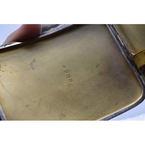 103 - A small group of silver and other metal items, comprising: a silver cigarette case, a silver vesta c... 