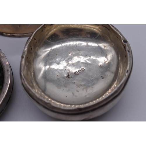 109 - An Edwardian silver mustard, by R H Halford & Sons, London 1905, 72g; together with two other si... 