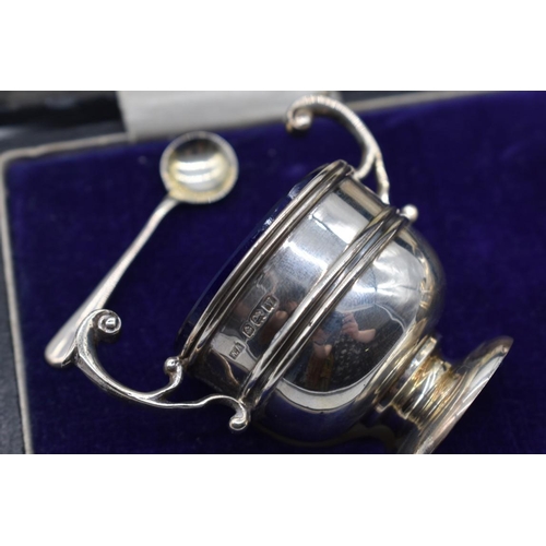 54 - A cased silver three piece condiment set, by William Adams Ltd, Birmingham 1911 & 1921, 102g.... 