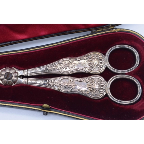 57 - A cased pair of Victorian silver grape scissors by Charles Reily & George Storer, London 1841, 1... 