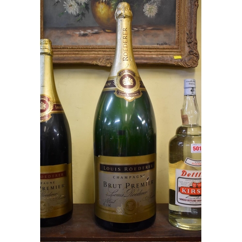 500 - Three large shop window champagne display bottles, comprising: a 12 litre Laurent Perrier; a 6 litre... 