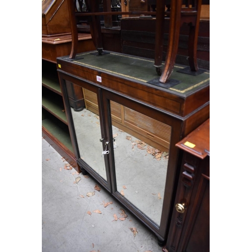 1236 - A mahogany side cabinet, with a pair of mirrored panelled doors, 81cm wide.