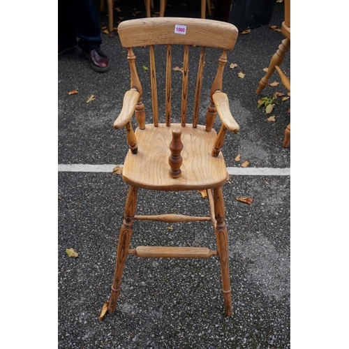 1060 - A child's beech and elm high chair. This lot can only be collected on Saturday 19th December (9-2pm)... 