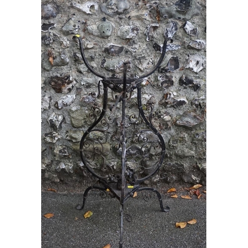 1067 - A wrought iron plant holder having blooming flower motif. This lot can only be collected on Saturday... 