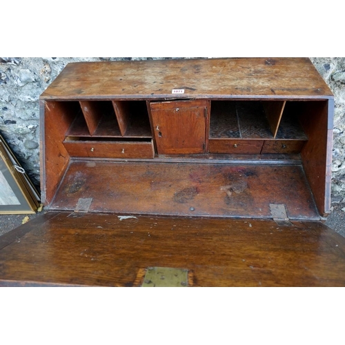 1071 - A mahogany and oak bureau, 91cm high x 76cm wide x 43.5cm deep. This lot can only be collected on Sa... 