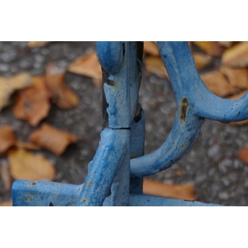 1074 - A blue painted cast iron garden bench. This lot can only be collected on Saturday 19th December (9-2... 