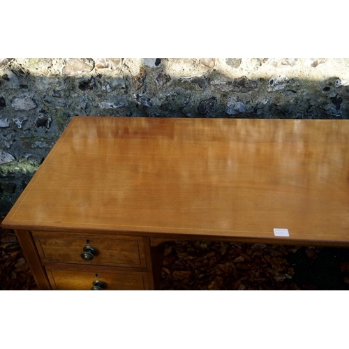 1079 - An Edwardian inlaid mahogany kneehole desk, (alterations), 130cm wide x 54.5cm deep x 76cm high.This... 