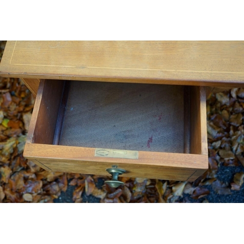 1079 - An Edwardian inlaid mahogany kneehole desk, (alterations), 130cm wide x 54.5cm deep x 76cm high.This... 