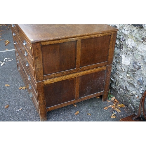 1092 - (THH) A vintage oak plan chest having six drawers.This lot can only be collected on Saturday 19th De... 