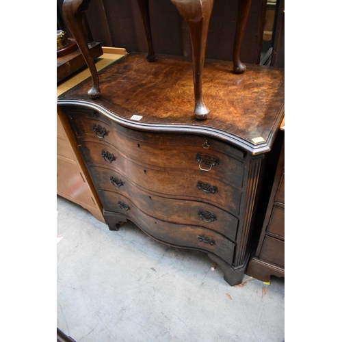 1343 - A 1920s burr walnut and crossbanded serpentine fronted chest, 76cm wide. 