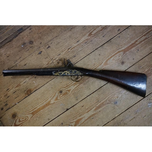 1927 - An 18th century flintlock carbine, the lock engraved 'Aston', 69cm overall length.