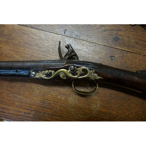 1927 - An 18th century flintlock carbine, the lock engraved 'Aston', 69cm overall length.