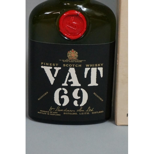 693 - An old half bottle of VAT 69 blended whisky, probably 1960s bottling, in card box.... 