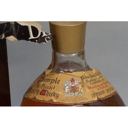 694 - Two old 26 2/3 fl.oz. bottles of Dimple blended whisky, comprising: a 1950s bottling, with spri... 