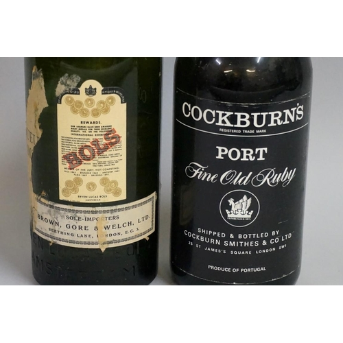 697 - An old bottle of Bolskummel liqueur; together with another old bottle of Cockburn's fine old ru... 