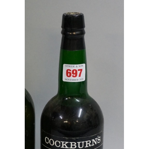 697 - An old bottle of Bolskummel liqueur; together with another old bottle of Cockburn's fine old ru... 