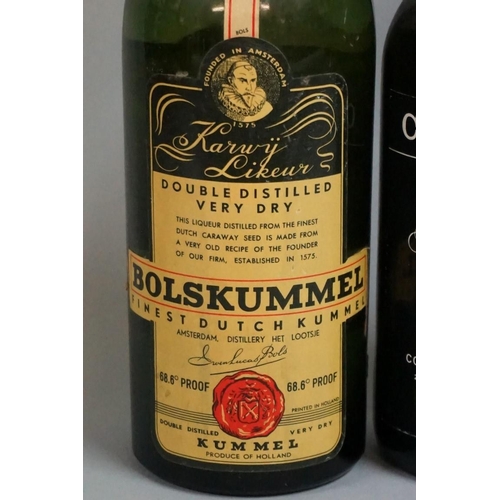 697 - An old bottle of Bolskummel liqueur; together with another old bottle of Cockburn's fine old ru... 