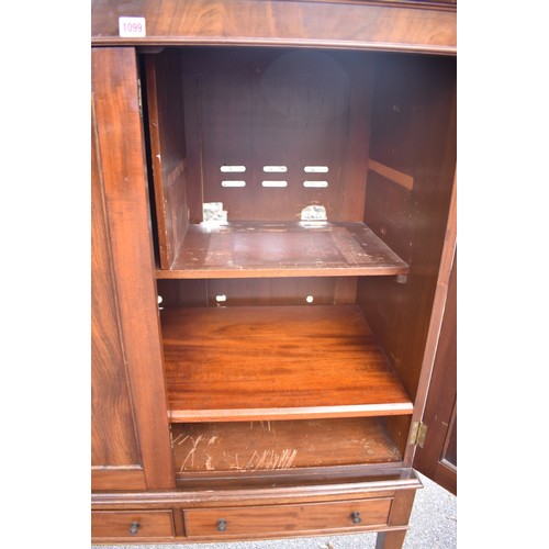 1077 - An antique mahogany cupboard having pair of doors and two small drawers, 101cm wide, (converted to m... 