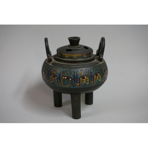 1551 - A Chinese bronze and cloisonne enamel twin handled tripod censer and cover, Qing, 17cm high.... 