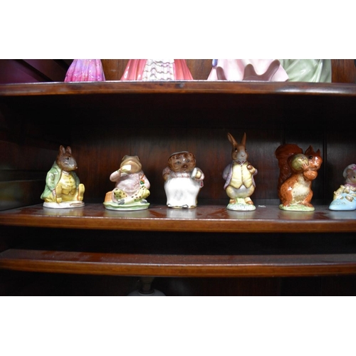 1561 - Eleven Beswick Beatrix Potter figures, comprising: 'Mr Benjamin Bunny', second version, lilac jacket... 