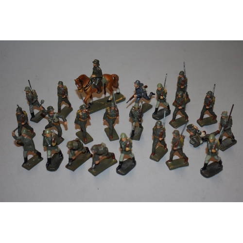 560A - Twenty three Lineol German World War II soldiers, to include a calvary figure, 5.7cm high; in a... 