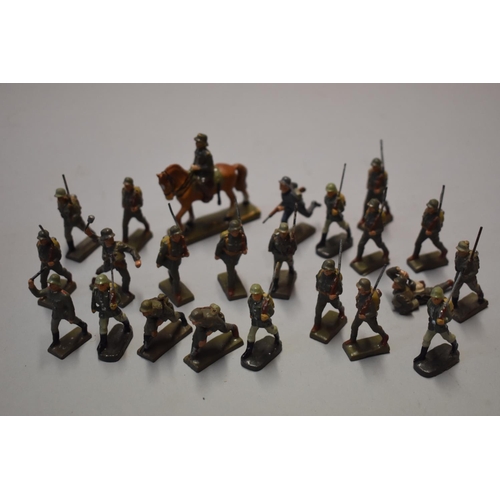 560A - Twenty three Lineol German World War II soldiers, to include a calvary figure, 5.7cm high; in a... 