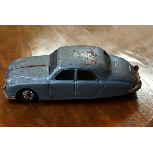 567 - A mixed group of vintage toys, comprising: a 'Made in Western Germany' tinplate 'Mercedes Benz W196'... 