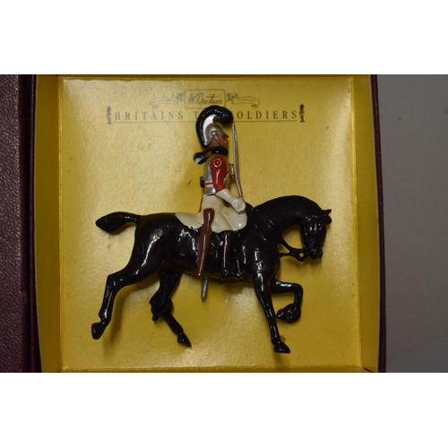 580A - Two Britain's cavalry figures, comprising 'Life Guard 1837'; and 'The Royal Dragoons', each boxed.... 