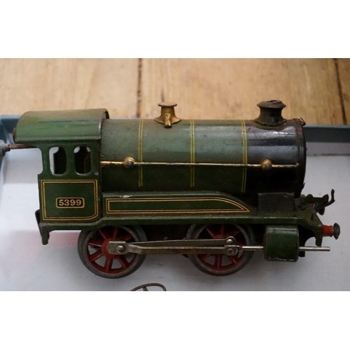 581 - A Hornby 'O' gauge clockwork GWR 0-4-0 tank locomotive 5399; with two wagons; wagon chassis; an... 