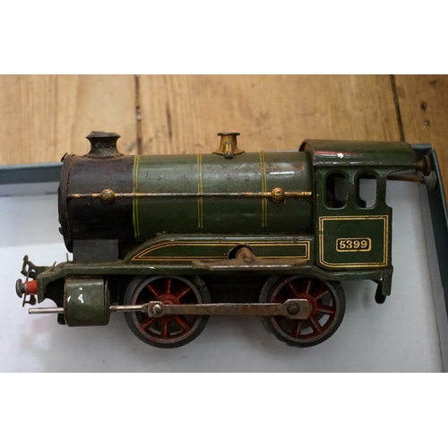 581 - A Hornby 'O' gauge clockwork GWR 0-4-0 tank locomotive 5399; with two wagons; wagon chassis; an... 