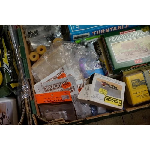 583 - A large collection of 'OO' gauge items, comprising: scenery; backdrops; signals; kits; etc, some box... 