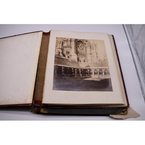 148 - PHOTOGRAPH ALBUMS: 2 folio albums, both worn with contents partially excised, numerous albumen ... 