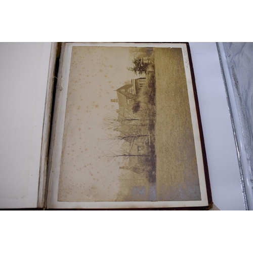 148 - PHOTOGRAPH ALBUMS: 2 folio albums, both worn with contents partially excised, numerous albumen ... 