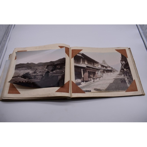 155 - PHOTOGRAPH ALBUM: JAPAN: varied album of approx 97 tinted albumen print views of Japan, circa 1900, ... 